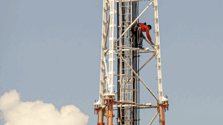man inspecting a communication tower